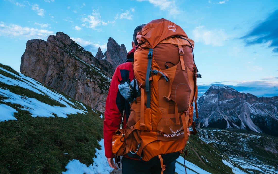 Trekking with backpack in mountains